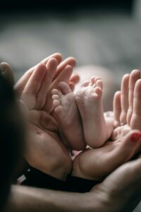 Family holding newborn while experiencing postpartum depression