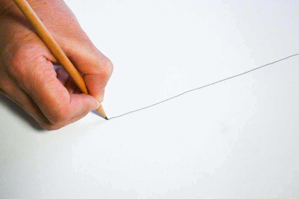 Individual drawing a line to symbolize setting boundaries.